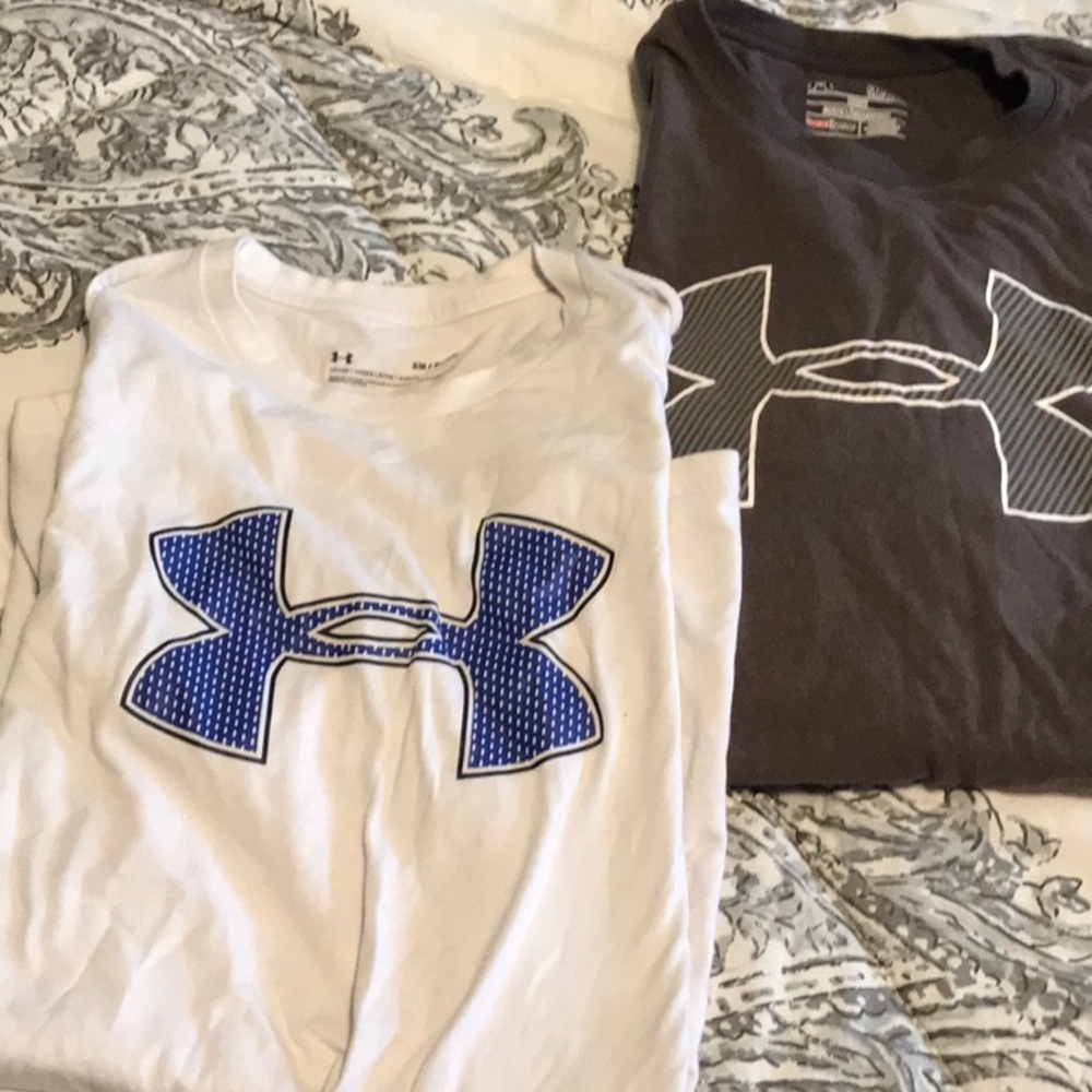 Two UA short sleeve shirts